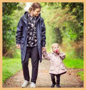 Child walking with mother signifying the importance of parent engagement in child's development