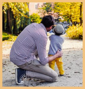 Child with father signifying the importance of parent engagement in child's development