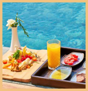 Arrangement of food next to pool signifying impact of guiding guest experiences