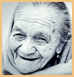 Smiling face of old woman signifying impact of patient-centric care