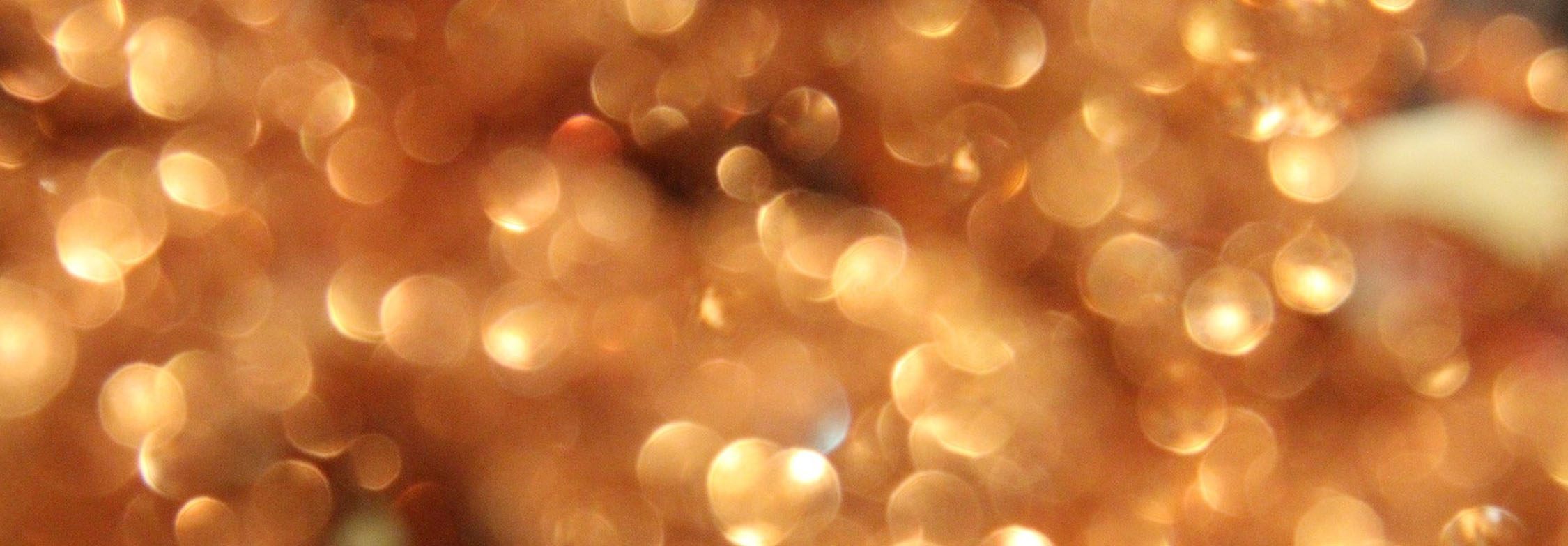Golden background of glitter and light signifying restoration and rejuvenation in hospitality settings