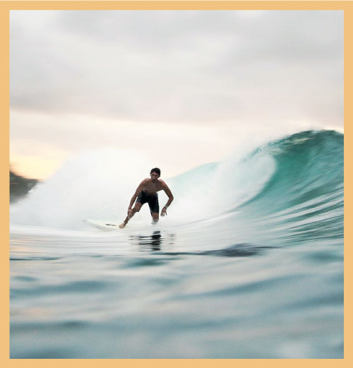 Man surfing on wave signifying relevance of business planning in strategy performance transformation