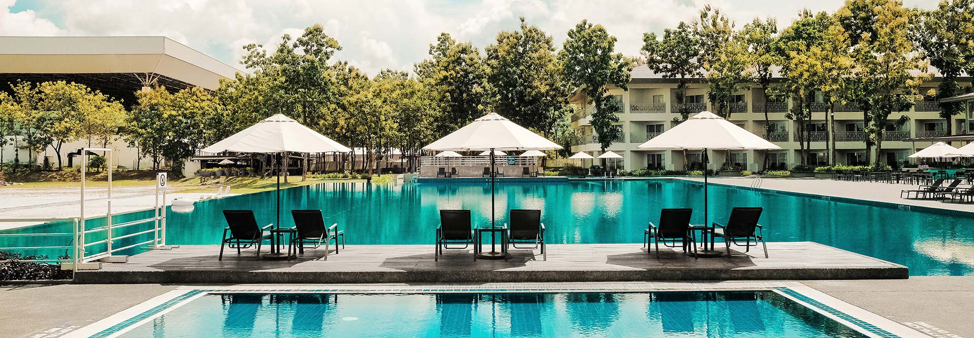 Tranquil view of swimming pool signifying a rejuvenating hospitality environment