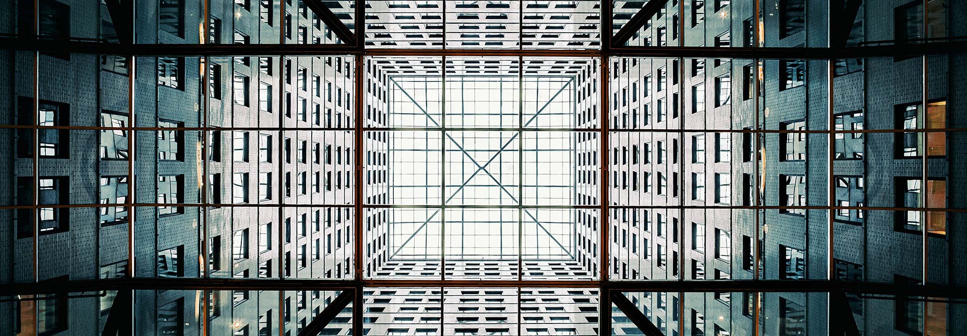 Geometric view of skyscraper courtyard signifying the importance of structural simplicity in organisation transformation